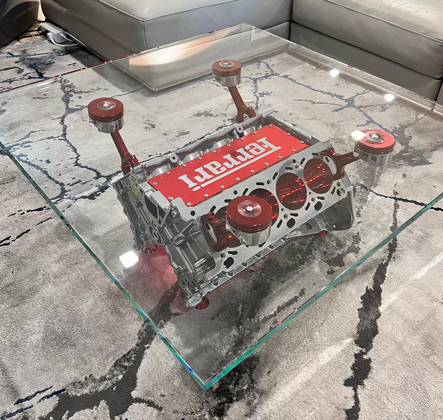 Custom specialty glass table created for a Ferrari display