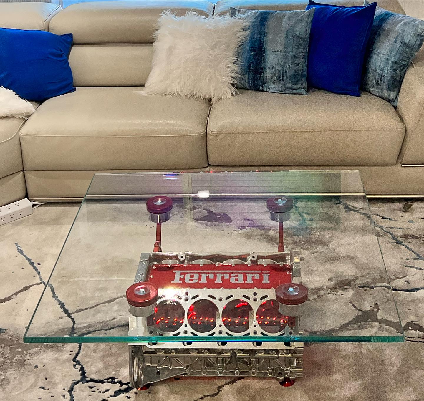 Detailed view of a custom Ferrari glass display table