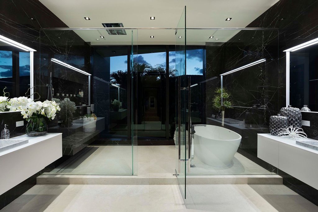 Custom frameless glass shower enclosure installed by Architectural Glass and Design