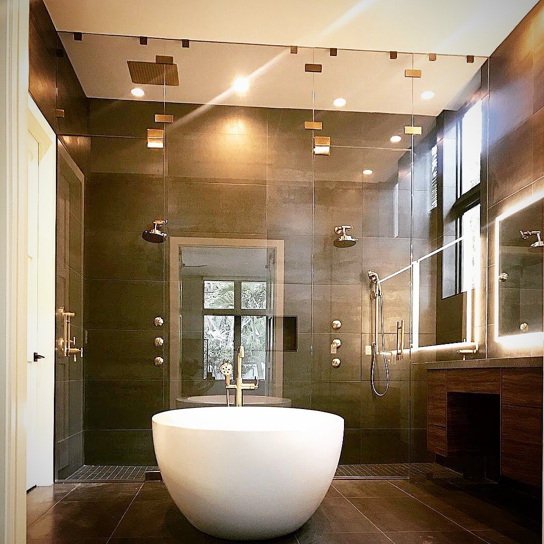 Custom frameless glass shower enclosure by Architectural Glass & Design