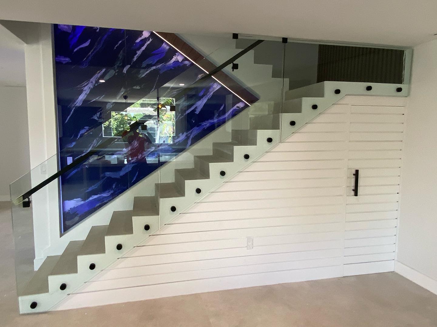 Commercial architectural glass installation with illuminated feature wall by Architectural Glass and Design