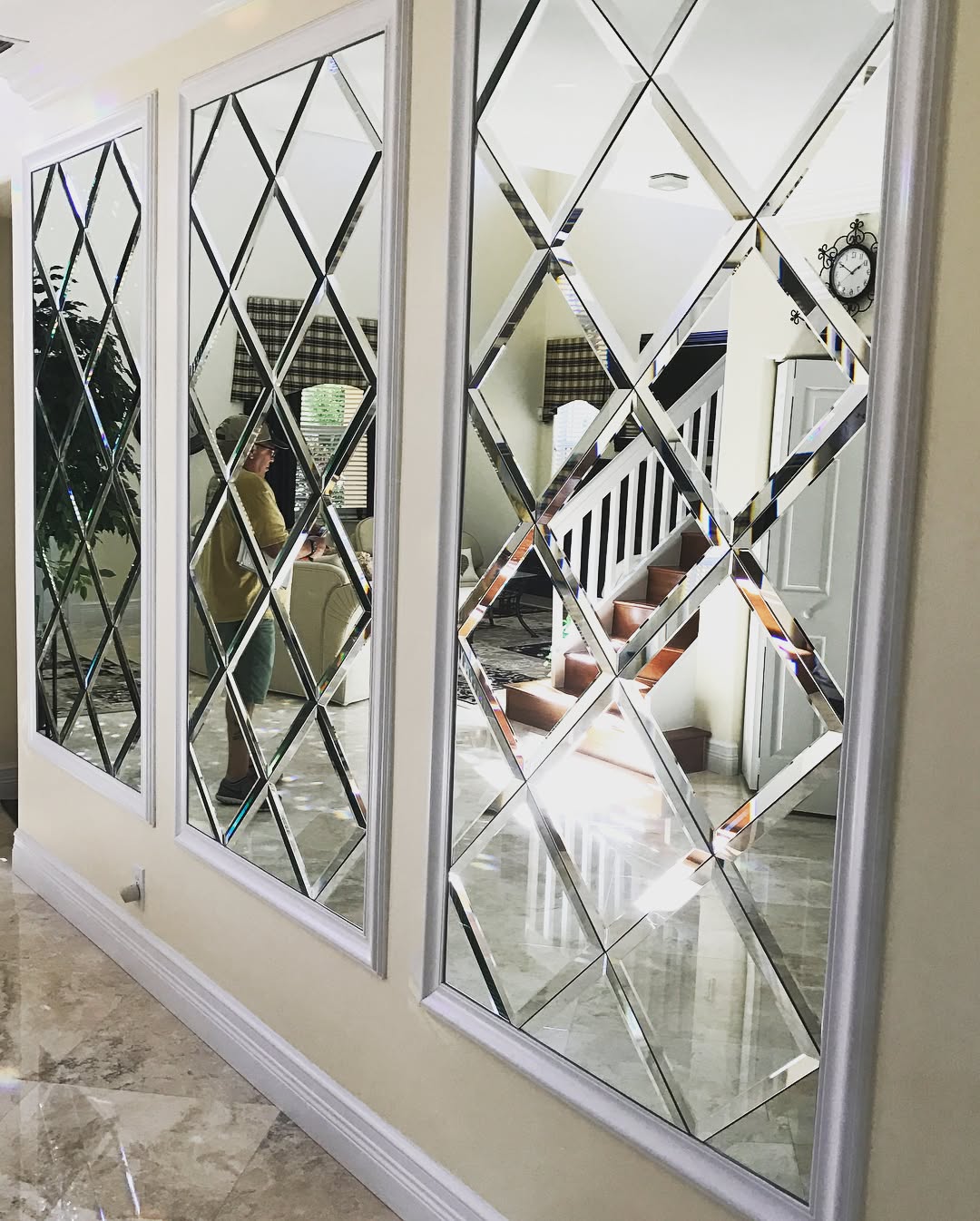 Custom wall mirror installation by Architectural Glass and Design