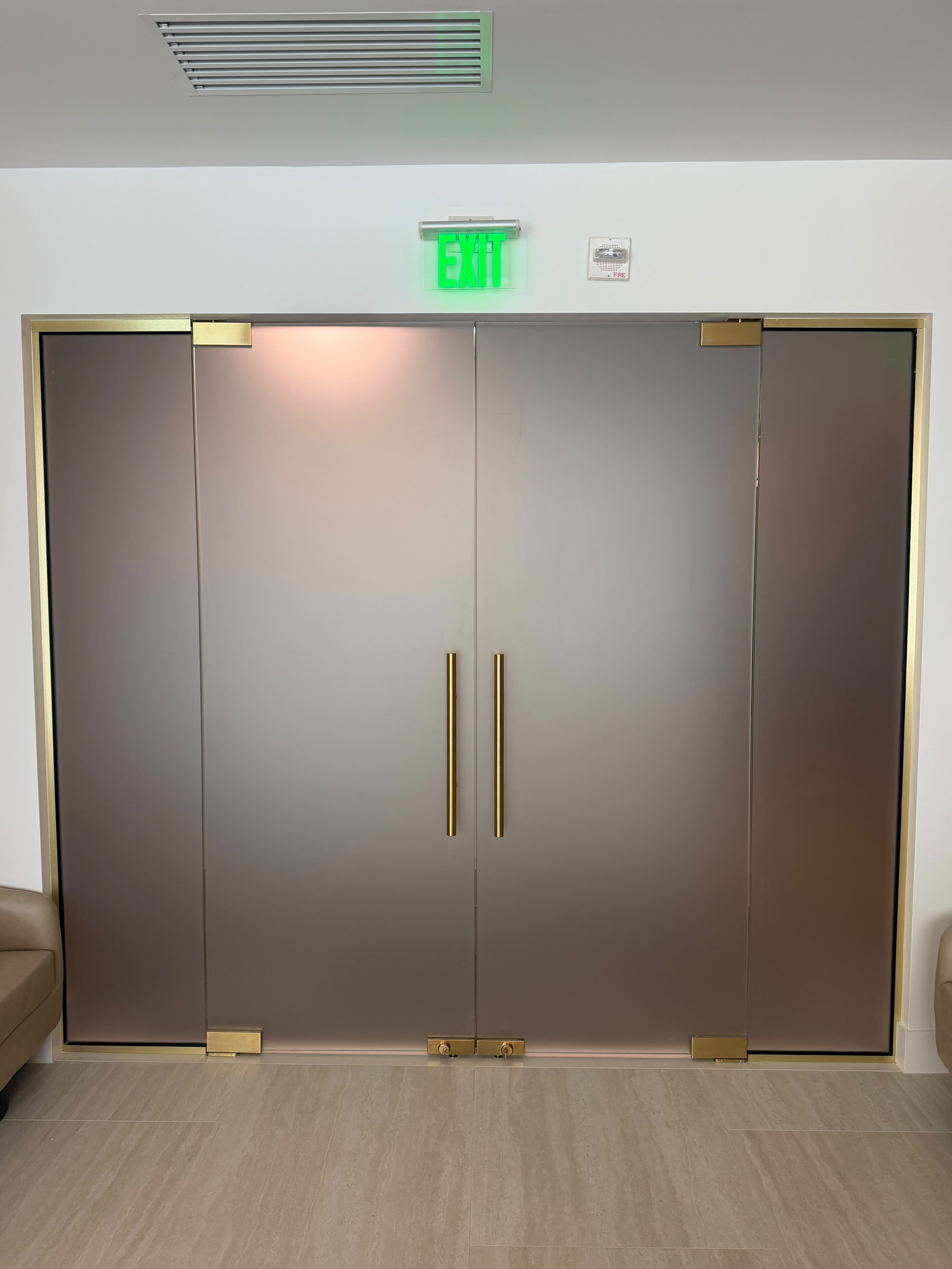 Custom glass doctor's lobby doors commercial interior